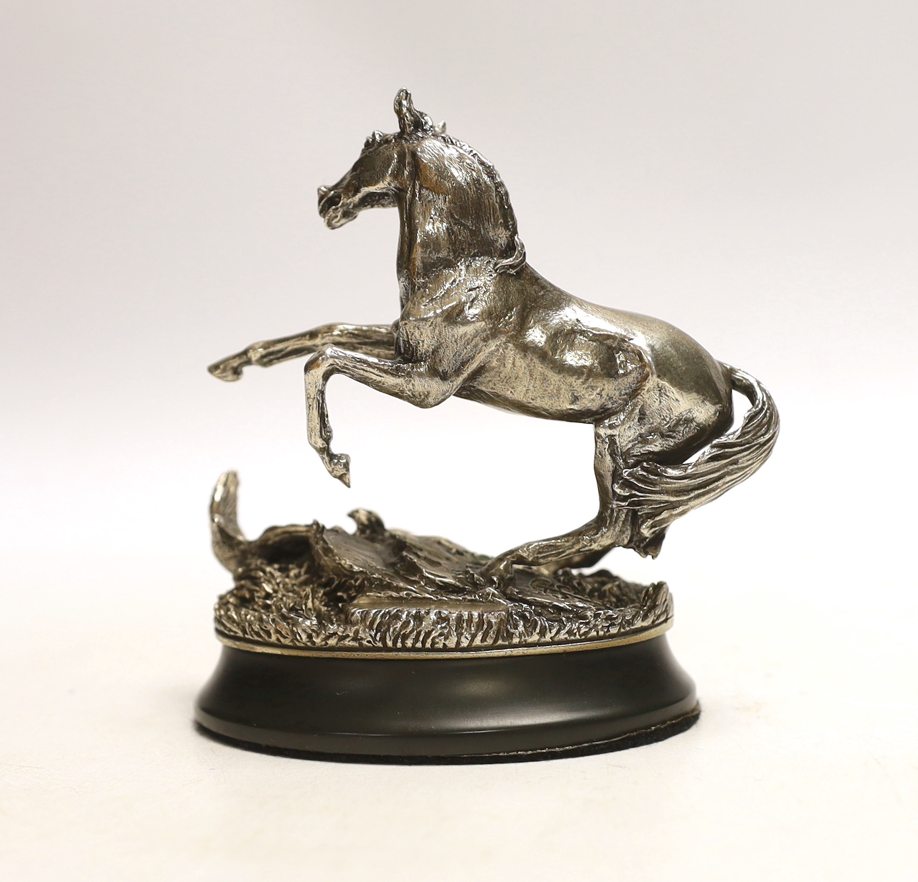 After Geoffrey Snell, a modern sterling 'The 1977 British Horse Society' model of a horse 'Startled Yearling', on weighted oval base, with certificate of authenticity, overall height 11.5cm.